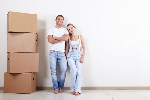 Furniture collection team handling bulky items at a Surrey property