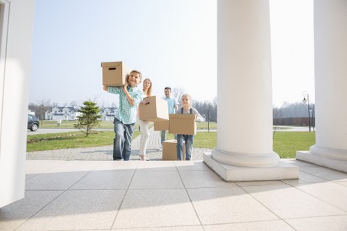 House removalists loading furniture for a Surrey home move