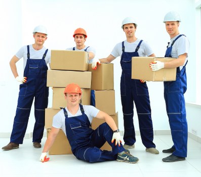 Removal team handling a flat move in a Surrey apartment building