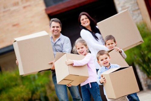 Packed moving boxes and protected household items ready for transport