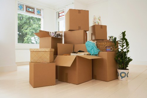 Packed office boxes and furniture ready for collection