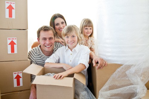 Loading household items into a van for a Surrey relocation
