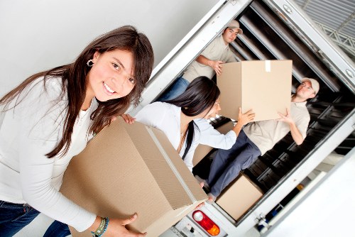 A removal team handling boxes during a Surrey home relocation